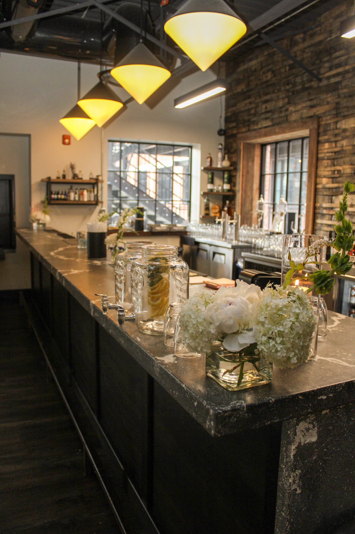 Flowers on a bar inside Paradigm event space in London Ontario